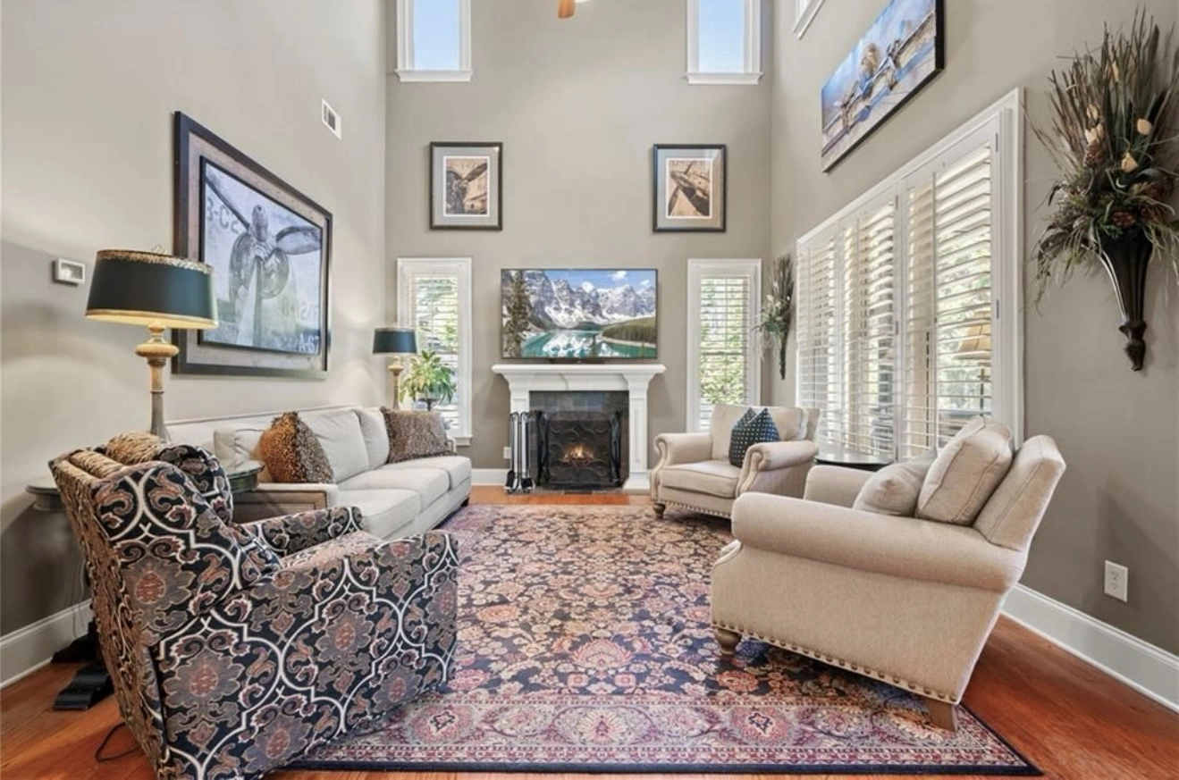 a well-decorated living room with a mix of traditional and modern elements